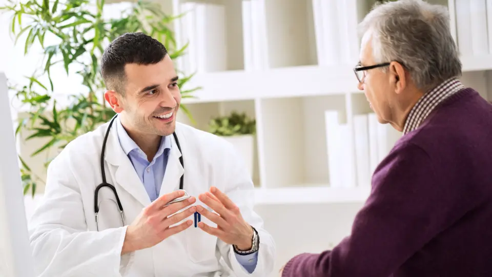 A doctor discussing medical concerns with an elderly patient.