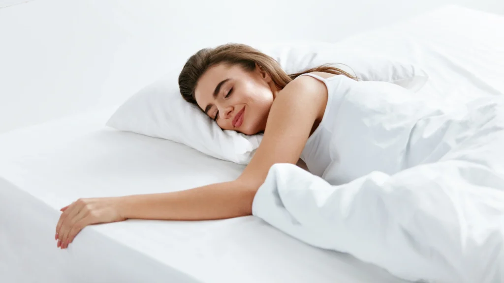 A woman using the best magnesium cream for sleep